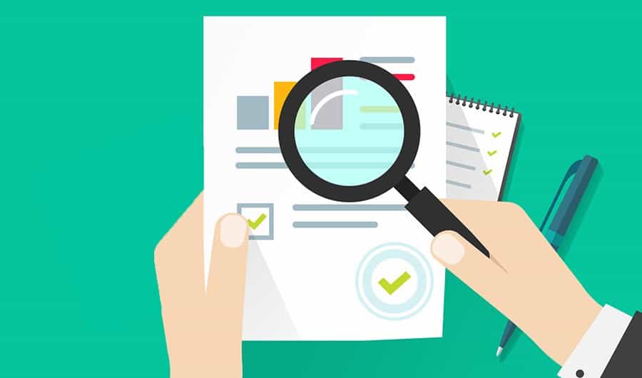 background report and magnifying glass